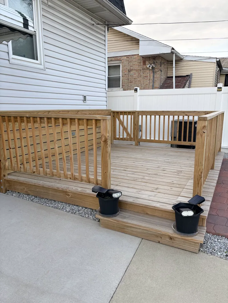 Cedar deck freshly stained in a warm redwood tone