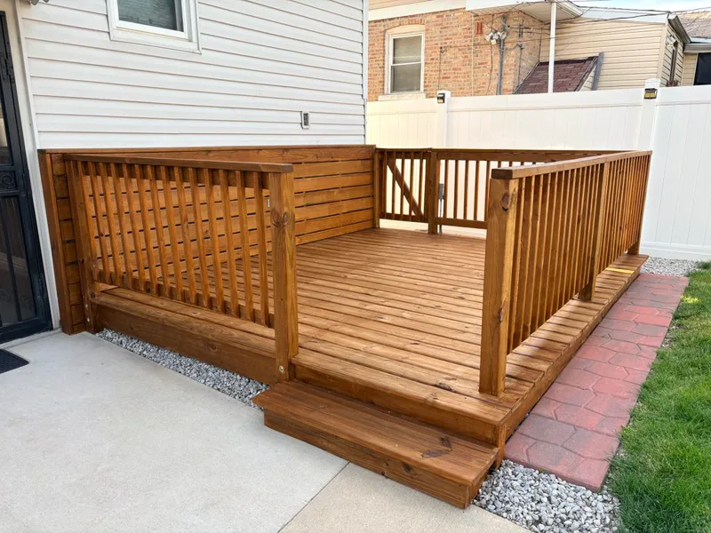 Cedar deck stained a warm redwood tone