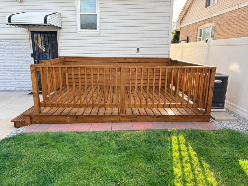 Stained cedar deck boards in warm redwood tone